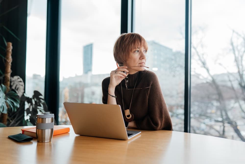 businesswoman looking out of window