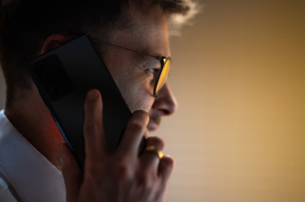 A man listening on a phone